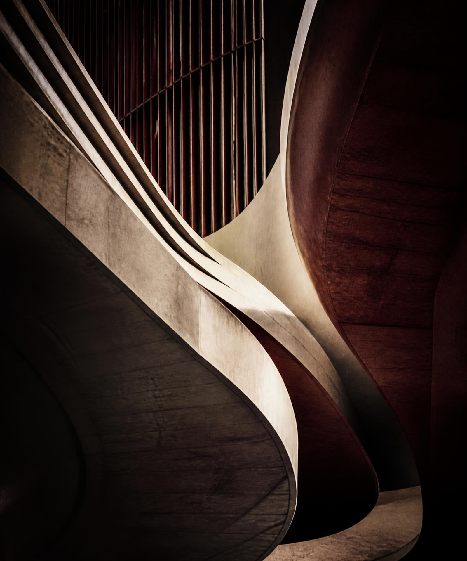 Abstract architectural forms in charcoal, ivory and wine